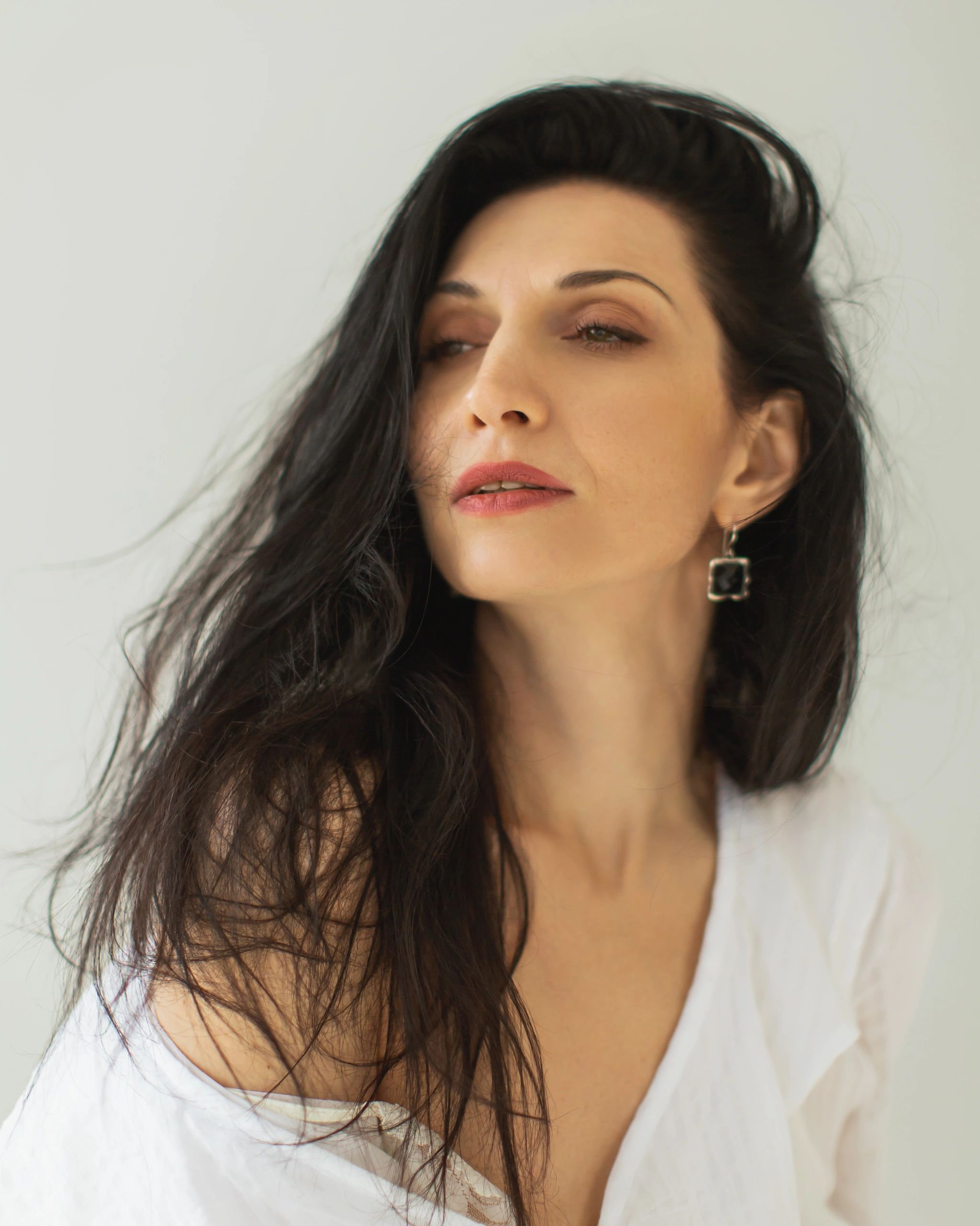 Portrait of a brunette woman smiling softly